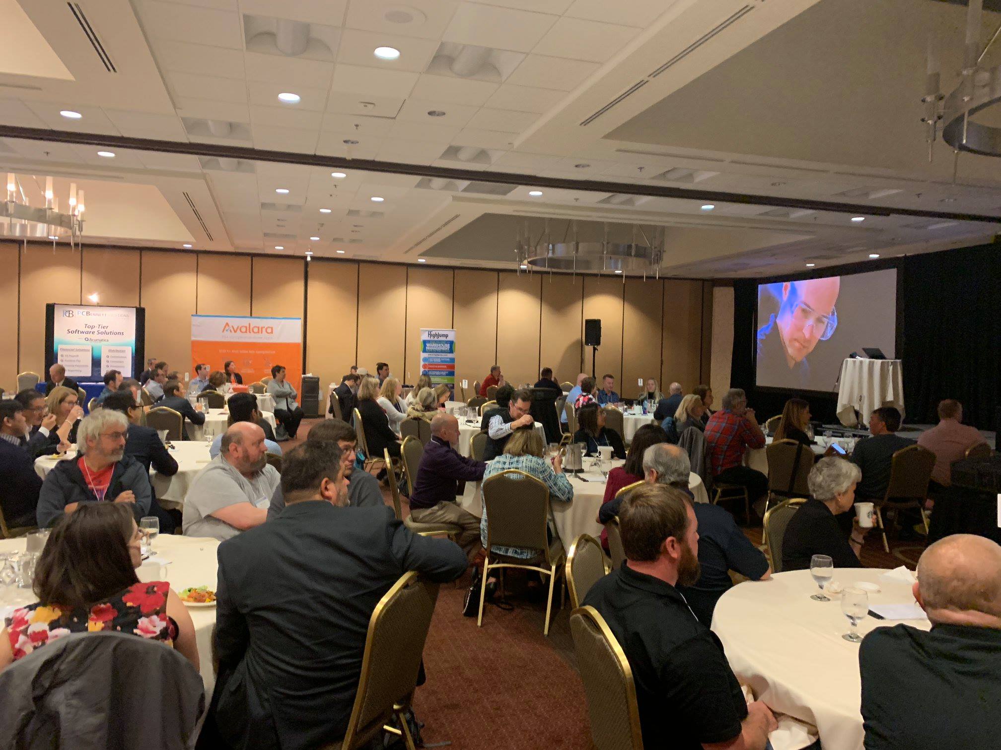 Attendees watching a customer success video testimonial at our Launch Event in Bellevue, Washington.