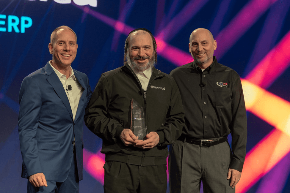 Acumatica CEO Jon Roskill presenting the 2018 Acumatica Customer of the Year award to Fabuwood.