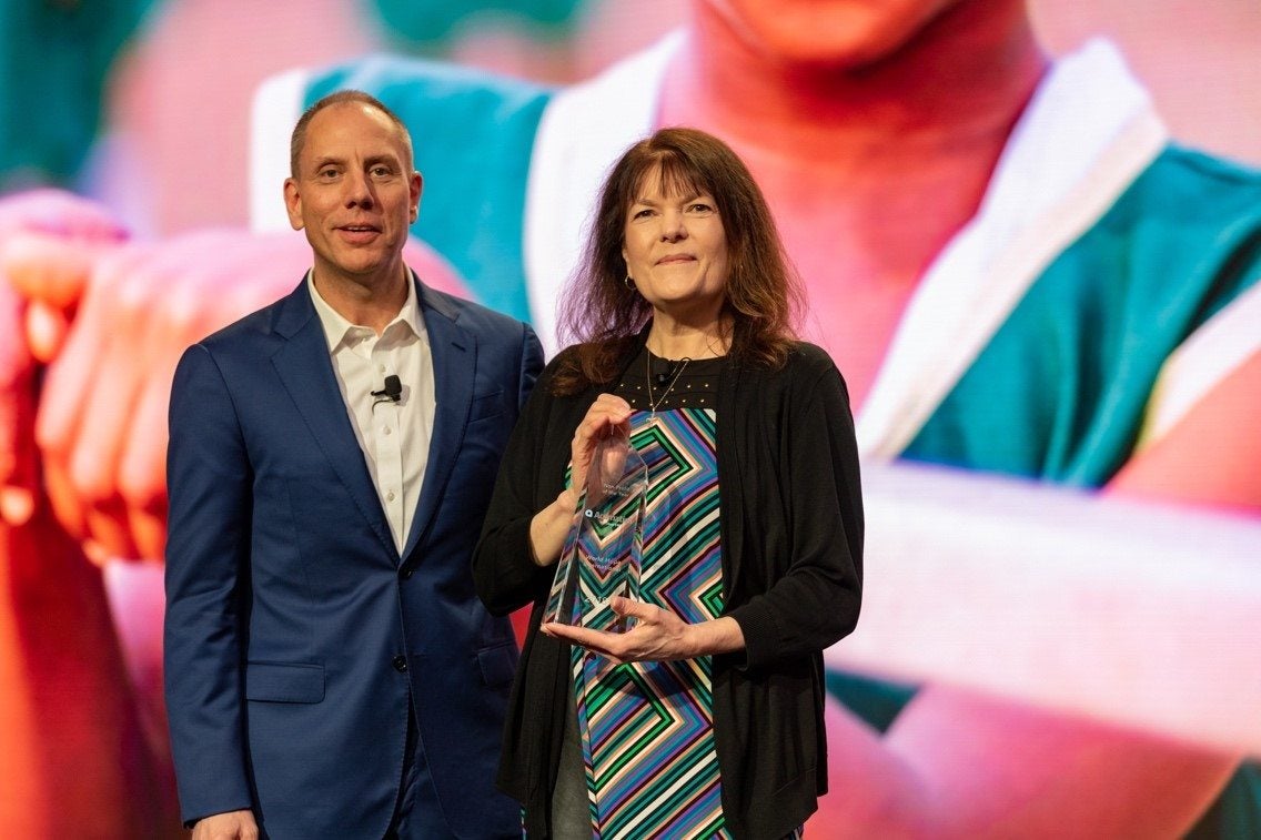 Acumatica CEO Jon Roskill presenting the 2018 Acumatica Non-Profit of the Year award to World of Hope International.